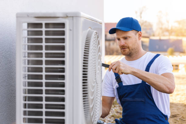HVAC technician servicing an outdoor air conditioner in Simi Valley