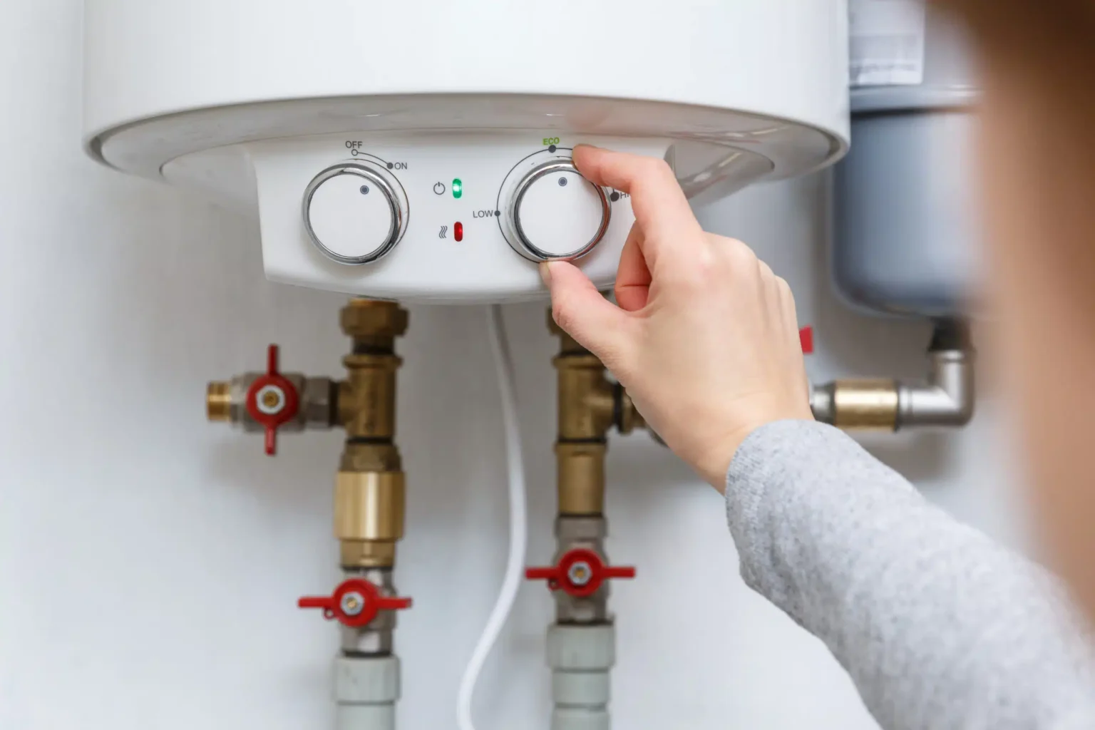 Technician adjusting a water heater in Simi Valley